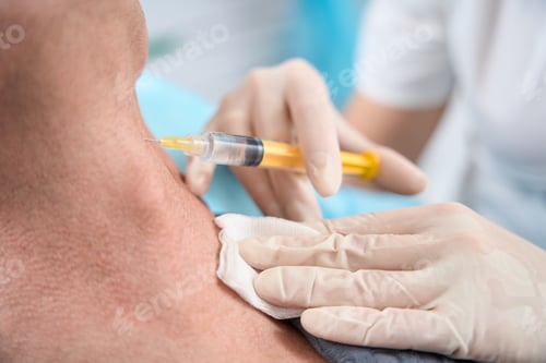 Preview: Skilled healthcare specialist doing a skin rejuvenation injection for patient