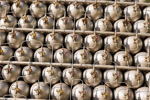 Preview: A lot of bottles filled with gas or gasoline are stacked in piles