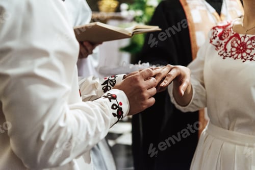 Preview: traditional wedding ceremony of stylish elegant bride and groom in the old church
