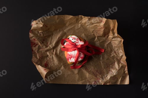 Preview: top view of halloween cookie in shape of ghost on baking paper