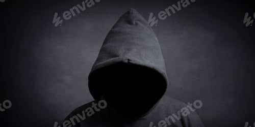 Preview: faceless person wearing black hoodie hiding face in shadow. mystery crime or conspiracy concept.