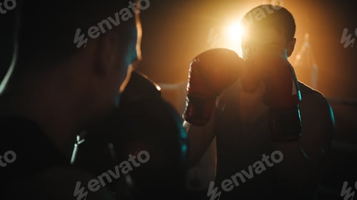 Preview: boxers fight in the ring at night