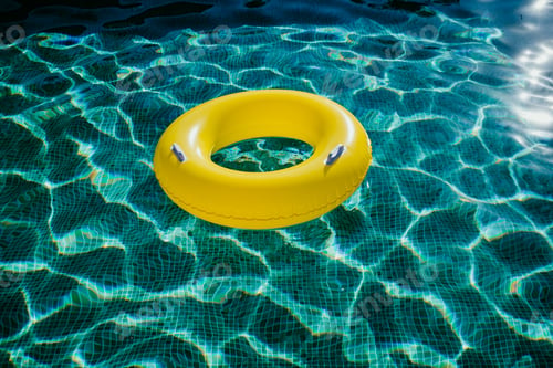 Preview: yellow inflatable donuts floating in a swimming pool. Nobody. Summer time concept