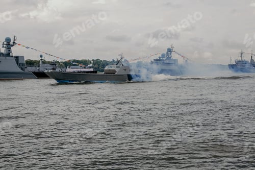 Preview: Russian warships in Volga river in Astrakhan in summer at cloudy day. Russian Military vessels.