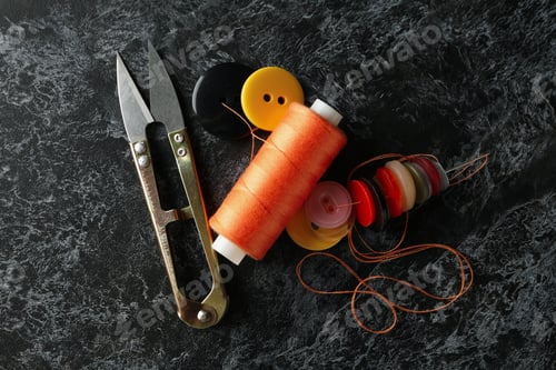 Preview: Sewing supplies on black smokey background, top view