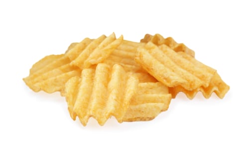 Preview: Heap of delicious ridged potato chips on white background