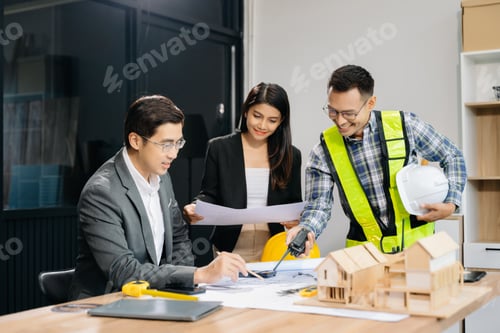 Preview: Engineer teams meeting working together wear worker helmets hardhat with on architectural project
