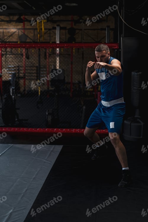 Preview: Close-up portrait of a boy boxer fighting with shadow