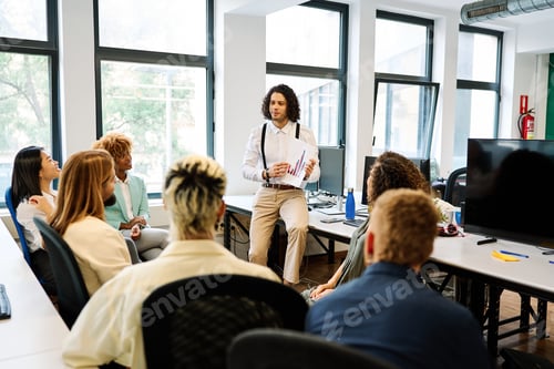 Preview: Man showing graphics during a meeting in a coworking
