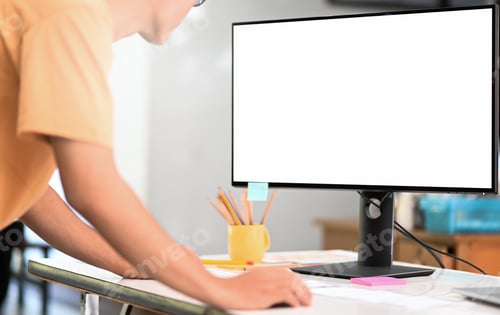 Preview: Young man operating a mockup computer big blank screen, using a computer to search for information.