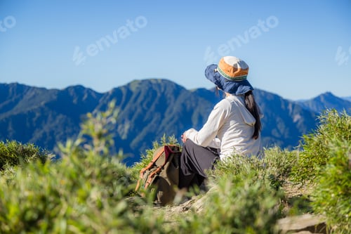 Preview: Woman relax during a mountain hike
