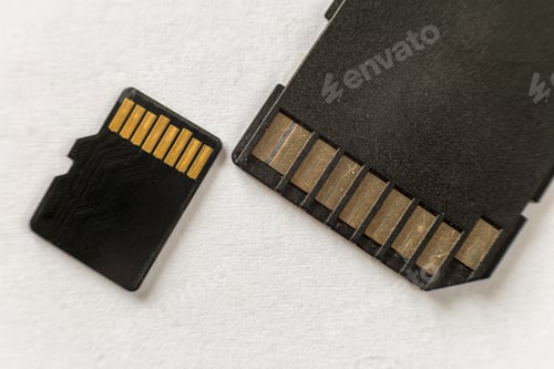 Preview: Close-up of micro SD memory card and SD adapter isolated on white copy space
