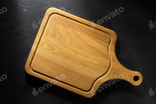 Preview: cutting board at black table