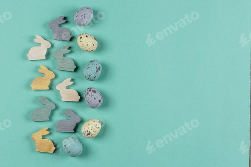 Preview: Easter background. Colorful pastel easter eggs, cute wooden bunny on background with copy space