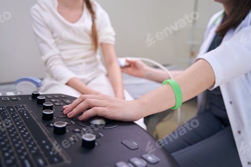 Preview: Female doctor conducts examination of a child on ultrasound machine