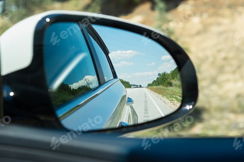 Preview: Car mirror close-up.