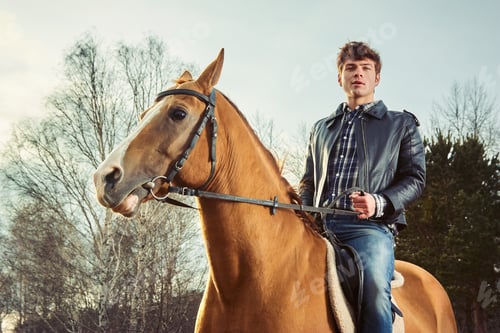 Preview: A man riding a horse outdoors