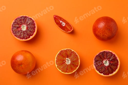 Preview: Flat lay with red oranges on orange background