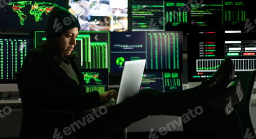 Preview: Hispanic female hacker hacking security firewall at night. Multiple screen background.