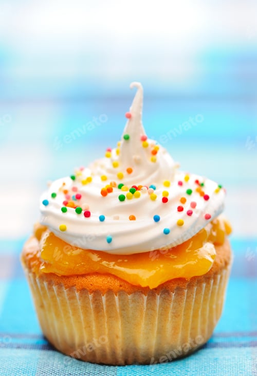 Preview: Cupcake with Frosting and Sprinkles on Blue Background