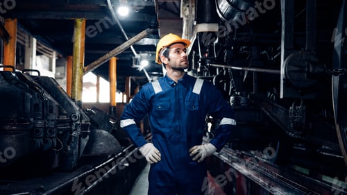 Preview: Engineer railway wearing safety uniform and helmet under checking under train.