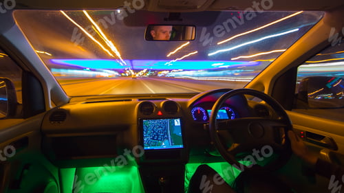 Preview: The man drive in the road with a navigation. Evening night time. Inside view