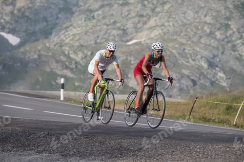 Preview: Switzerland, Engadin, two cyclists on Bernina Pass