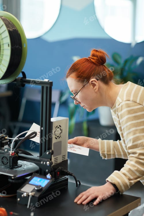 Preview: Female Student using 3D Printer in Engineering Class