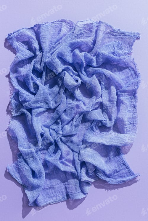 Preview: top view of purple gauze fabric on purple backgroundtissue