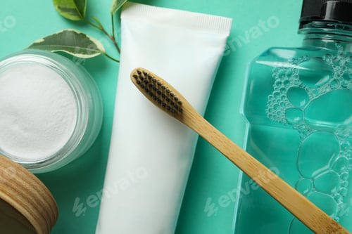Preview: Oral care accessories on mint background, close up