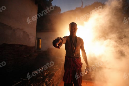 Preview: Portrait of Asian old Man with smoke Posing for Camera in Dark Room.