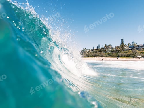 Preview: Blue Ocean Wave Breaking on a Sunny Beach on Summer.Vacations Concept.Summertime Concept