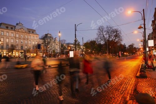 Preview: People crossing city street at evening, long exposure effect