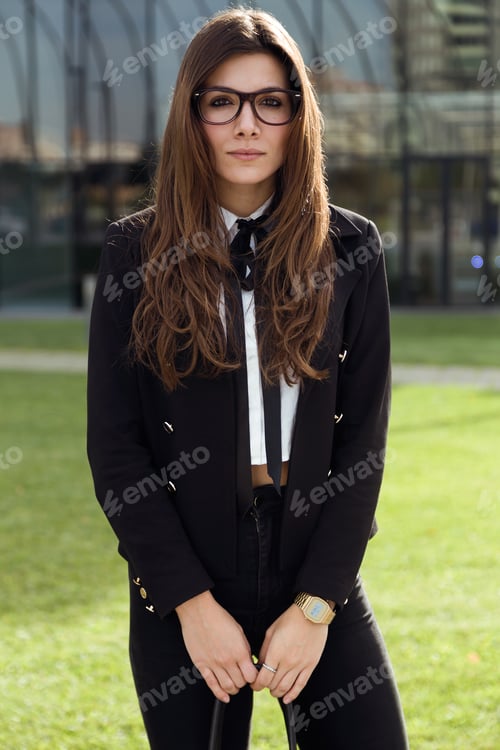 Preview: Young woman standing on the street