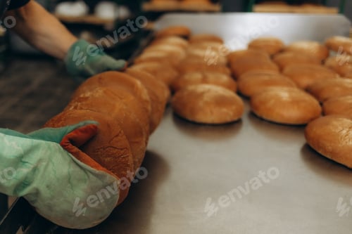 Preview: A lot of bread prepare to move on in the shelf. Bread bakery food factory production with fresh