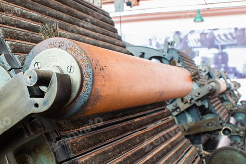 Preview: Selective focus shot of textile production machine