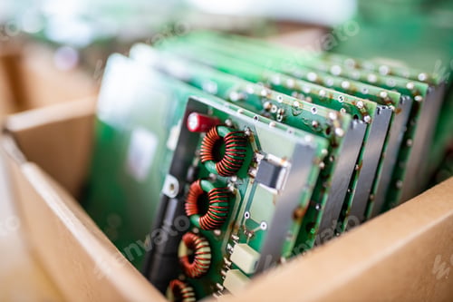 Preview: Green control chips of TFT monitors in cardboard box in shop