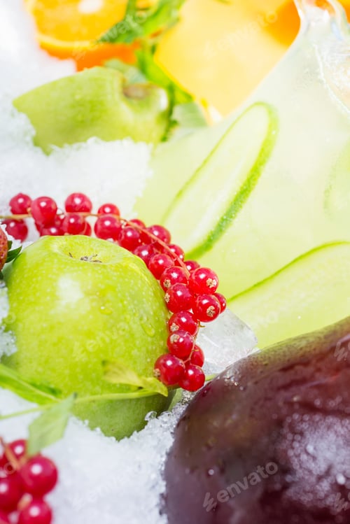 Preview: delicious lemonade carafes of cucumber and orange and basilon with creative composition. soft focus