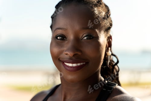 Preview: African american woman laughing and looking at the camera after sport session