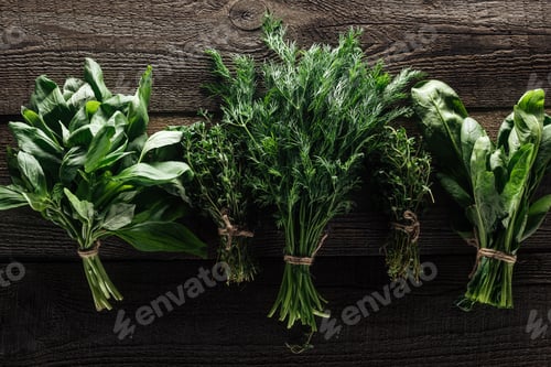 Preview: top view of green thyme, spinach, basil and dill on wooden weathered table