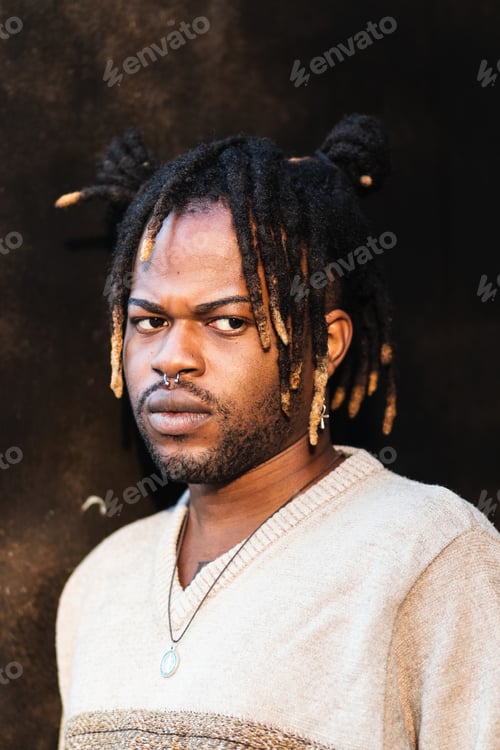 Preview: Stylish black man with dreadlocks in buns
