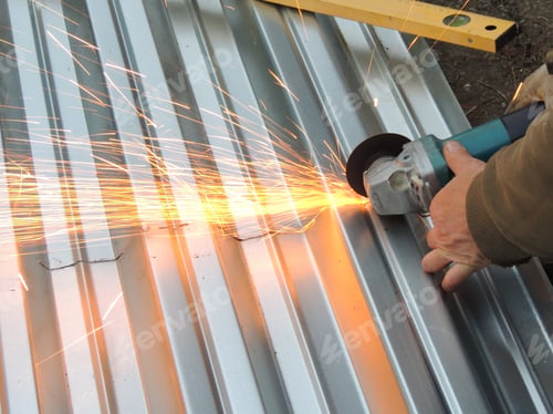 Preview: sawing an iron sheet with a grinder with flying sparks