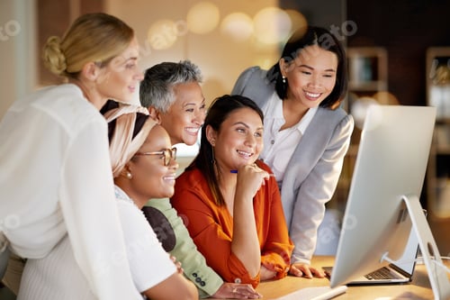 Preview: Happy, women and creative collaboration on computer at night in office for teamwork, planning or de