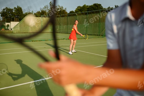 Preview: Man and woman with rackets, tennis training
