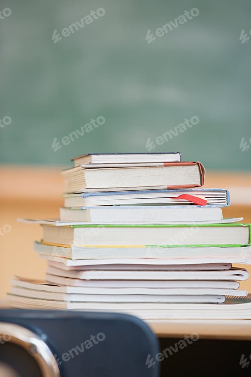 Preview: Stack of textbooks in classroom
