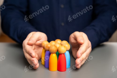 Preview: Boss defending his team with a gesture of protection.Security and safety in a business team concept.