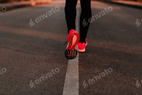 Preview: unrecognizable athlete male running on the road. sports outdoors