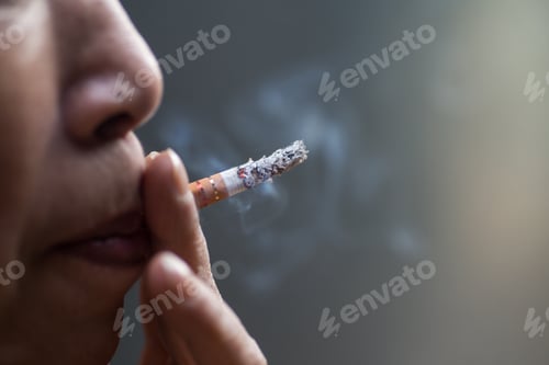 Preview: Selective focus shot of a Chinese woman smoking
