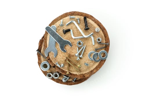 Preview: Work tools on wooden slices isolated on white background