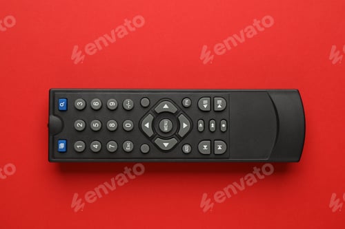 Preview: Remote control on red background, top view